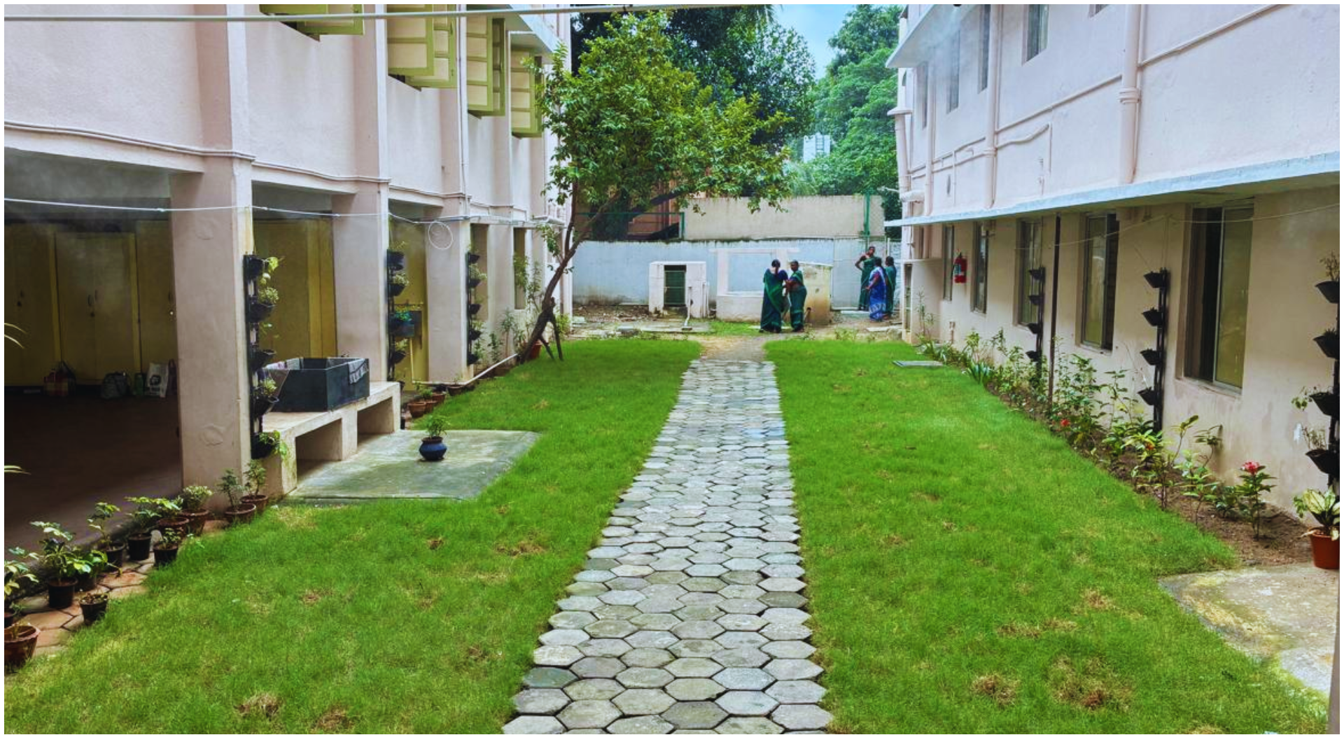 After: landscaped courtyard with a completed walkway